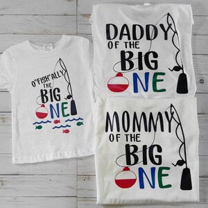 First Birthday matching family shirts. O'fish'ally the Big One. Mom, dad, and birthday child short sleeve white t-shirts.