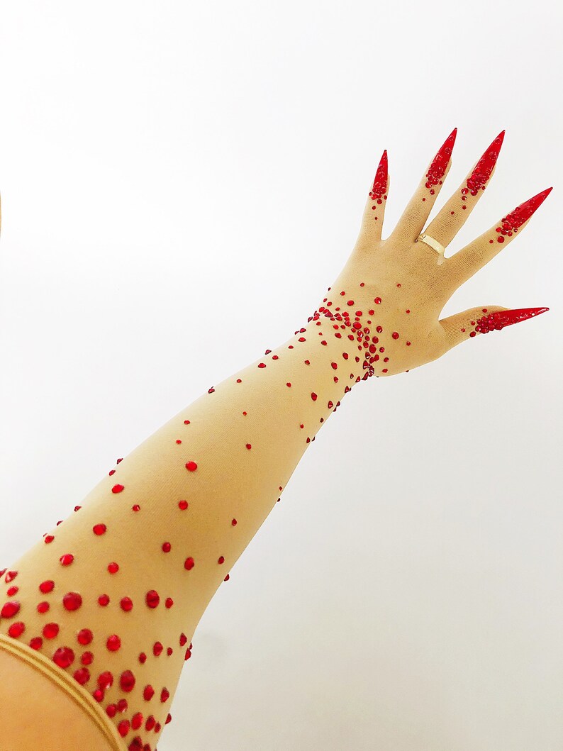 Sheer faux skin nail gloves with red stiletto nails and red glass rhinestones for drag queens burlesque performers and Dancers