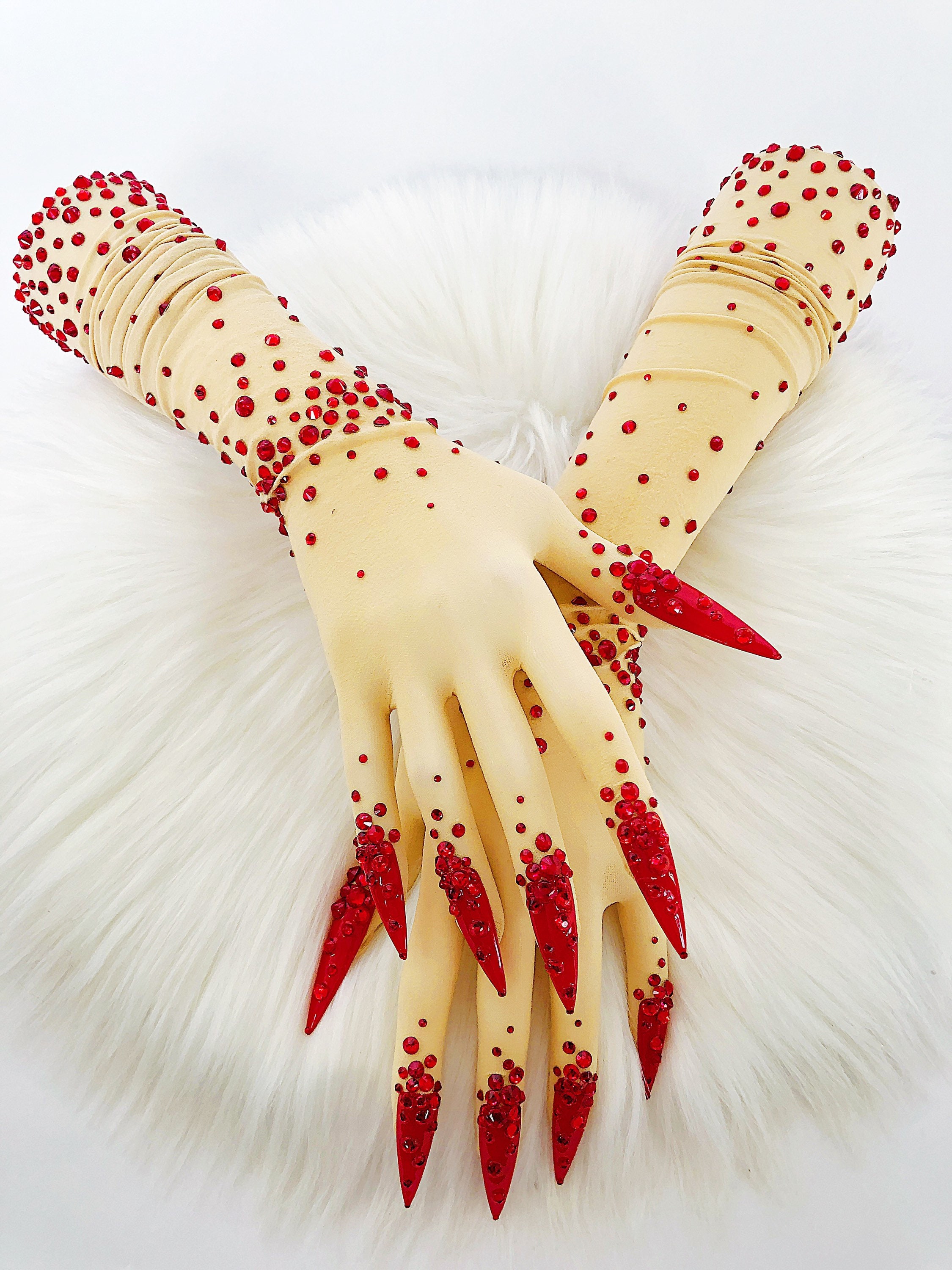 Sheer faux skin nail gloves with red stiletto nails and red glass rhinestones for drag queens burlesque performers and Dancers