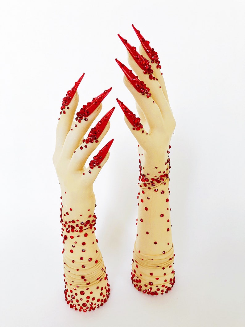 Sheer faux skin nail gloves with red stiletto nails and red glass rhinestones for drag queens burlesque performers and Dancers