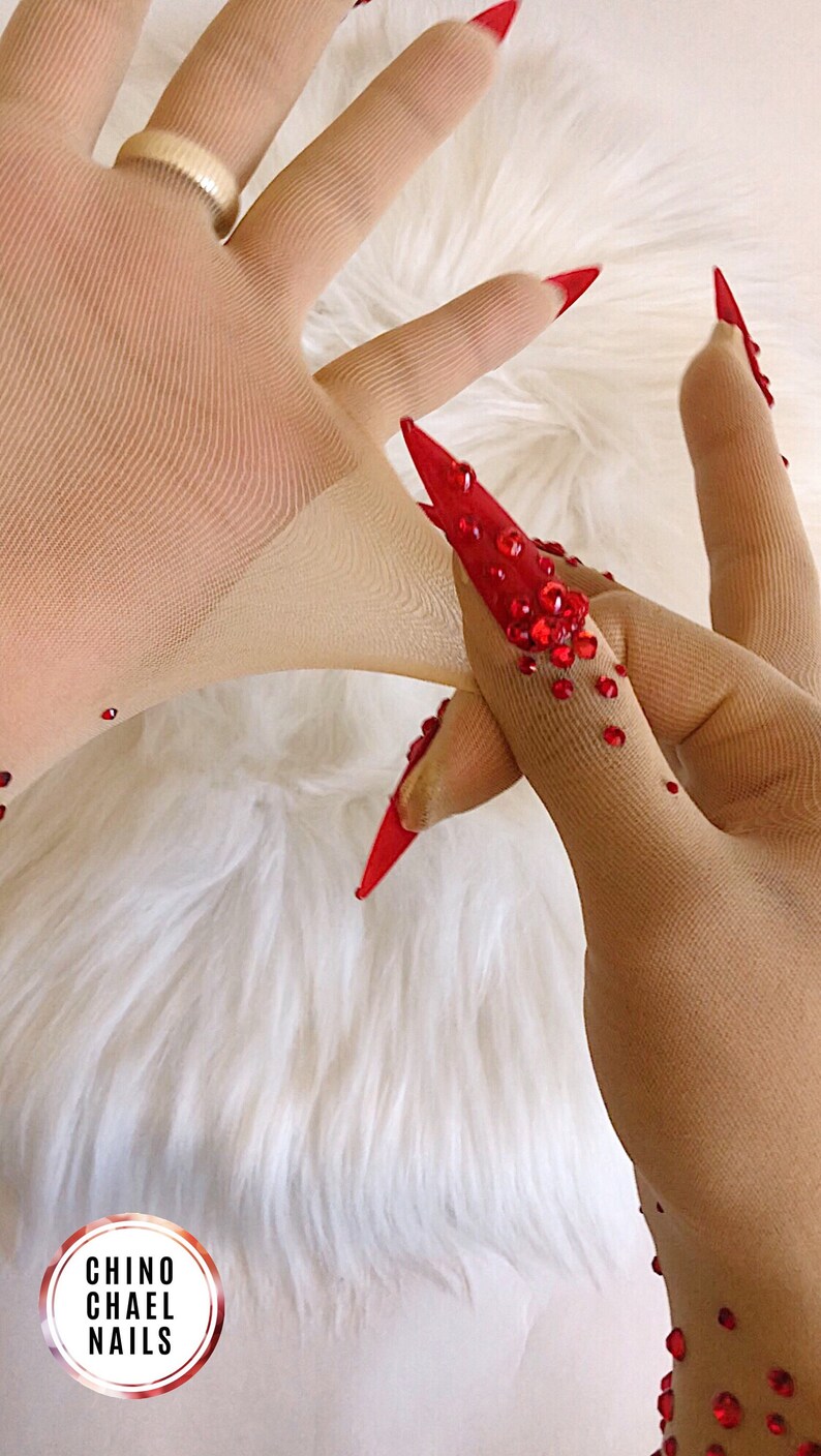 Sheer faux skin nail gloves with red stiletto nails and red glass rhinestones for drag queens burlesque performers and Dancers