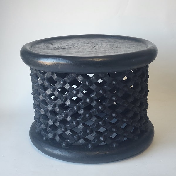 Hand crafted from a tree trunk and hand carved/bamileke stools sieze in inches
