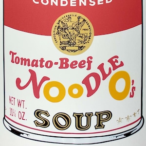 May include: A red and white Campbell's Soup can with the text "Tomato-Beef Noodle Soup" and a gold seal with the text "Exposition Universelle Internationale 1900".