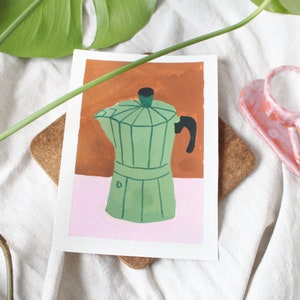 May include: A green and black coffee pot painted on a white card with a brown and pink background.