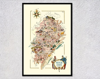 May include: A vintage illustrated map of the Franche-Comté region of France. The map is in a light pink color with a compass rose in the upper left corner. The map is filled with small illustrations of local landmarks, animals, and people. The text "Franche-Comté" is written in blue at the bottom of the map.