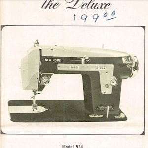 May include: A black and silver New Home sewing machine, model 534, with the words "the Deluxe 19900" written above it.