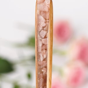 May include: A set of three ceramic mugs with a speckled, matte finish. The mugs are in shades of cream, light gray, and dark gray. Each mug has a simple, minimalist design and a rounded handle.