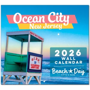 May include: A 2026 wall calendar featuring a lifeguard stand on a beach in Ocean City, New Jersey. The calendar has a blue and white design with the words "Beach Day Gifts & More". The lifeguard stand is green and white.
