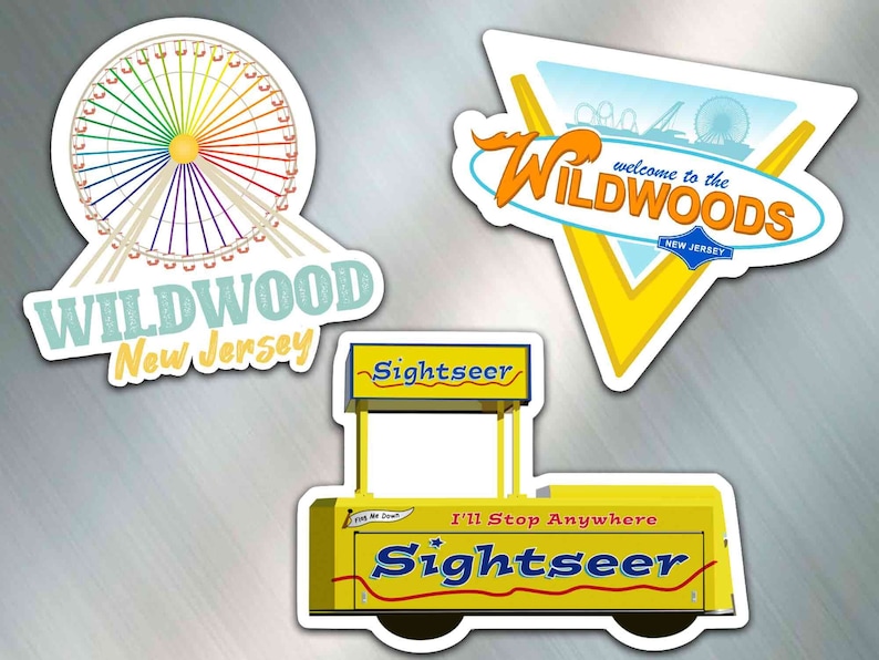 May include: Three yellow and white stickers with a Wildwood, New Jersey theme. The first sticker features a Ferris wheel with a rainbow design. The second sticker is a yellow triangle with the text "Welcome to the Wildwoods, New Jersey". The third sticker is a yellow food cart with the text "Sightseer, I'll Stop Anywhere".