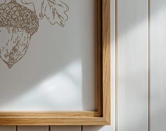 Lámina decorativa imprimible con diseño de bellota y estampado botánico otoñal en tonos neutros.