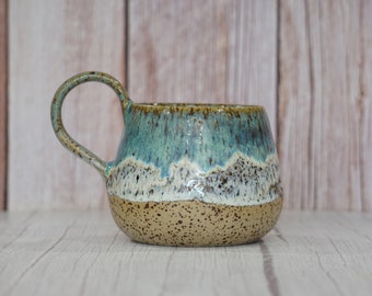 Ceramic colorful mug or pottery handmade coffee cup