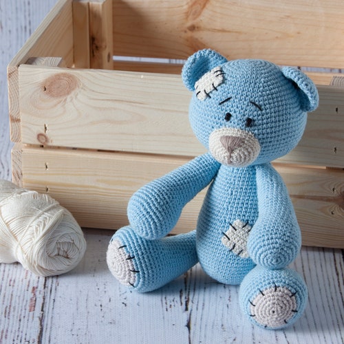 Bear with crochet patches.