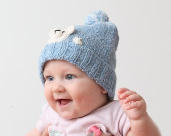 Blue beanie with teddy bear for baby 0,5-2 years old. Made of tweed yarn, a combination of merino wool, alpaca superfine and viscose