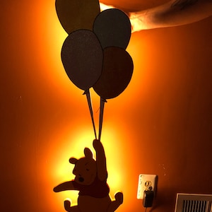 Illuminated Winnie the Pooh with dimmable LED lighting and glitter