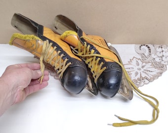 Patins de hóquei vintage em couro: amarelo e preto, tamanho 11, fabricados no Canadá