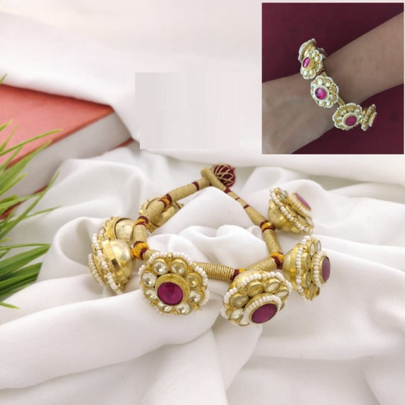 Kundan and pearls bracelet with green stones by Heer House Of Jewellery |  The Secret Label
