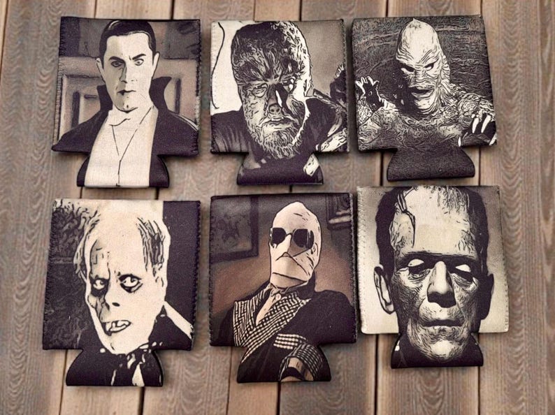 May include: A set of six black and white foam can coolers featuring detailed illustrations of classic horror movie characters including Dracula, the Wolf Man, the Creature from the Black Lagoon, the Phantom of the Opera, the Invisible Man, and Frankenstein's monster.