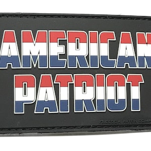 May include: Black patch with the words "AMERICAN PATRIOT" in white, red, and blue letters with a red, white, and blue stripe design. The words "FREEDOM PATCH COMPANY" are printed in white at the bottom.