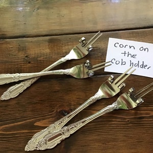 Corn on the cob, cheese, holder.  set of two.