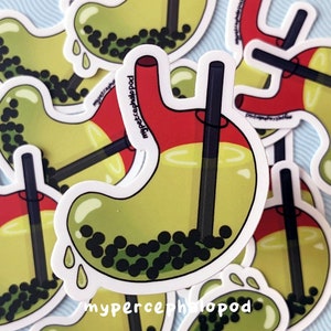 May include: A set of six stickers featuring a cartoon stomach with a boba tea straw and boba pearls inside. The stickers are white with a red, yellow, and green design. The text "myperceptholopod" is printed on the stickers.