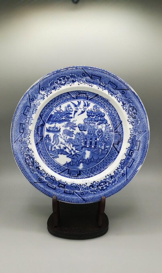 An antique flow blue willow pattern tea plate or side plate So collectible!