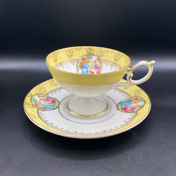 Japanese Porcelain Footed Courting Couple Vintage Teacup and Saucer in Yellow, c. early to mid 1900's