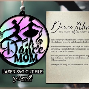 May include: A laser cut SVG file design for a circular ornament featuring two dancers and musical notes. The text "Dance Mom" is written in a decorative font. The background is a gradient of pink, blue, and purple.