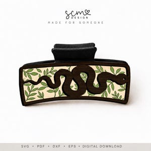 May include: A black hair claw clip featuring a dark brown wooden snake silhouette layered over a cream-colored background with a green leaf pattern. The text "scm design" and "made for someone" appears above, with "svg pdf dxf eps digital download" below.