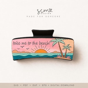 May include: A black hair claw clip featuring a rectangular panel with a printed beach scene. The design includes a pink sky, an orange sun, blue ocean waves, and two palm trees. The text "take me to the beach" is printed in black script.