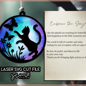 May include: A laser cut file design featuring a silhouette of a cat reaching for a butterfly against a galaxy-like background with flowers. The text "Embrace the Joy" is included in the design.