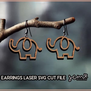 May include: A pair of wooden elephant earrings with a laser cut design. The earrings are hanging from a branch.
