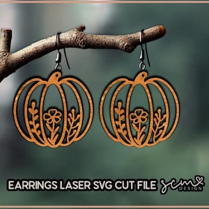 May include: A pair of wooden pumpkin earrings with a floral design. The earrings are laser cut and ready to be assembled.