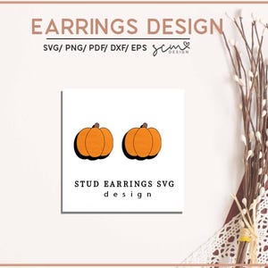 May include: A digital design for a pair of pumpkin stud earrings. The design features two orange pumpkins with brown stems. The text "STUD EARRINGS SVG design" is below the pumpkins.