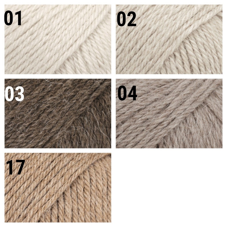 May include: Close-up of five yarn skeins in different shades of beige, brown, and gray. The skeins are labeled with numbers 01, 02, 03, 04, and 17.