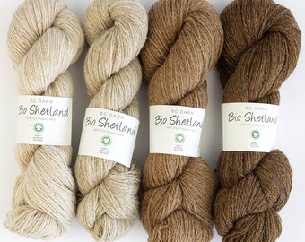 May include: Four skeins of yarn in different shades of brown. The yarn is labeled "Bio Shetland 100% Pure Organic Wool" and is made by BC Garn.
