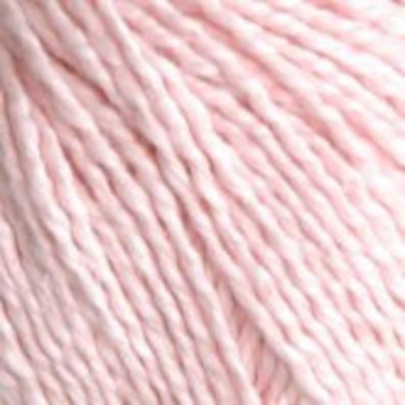 May include: A skein of pale pink cotton yarn.
