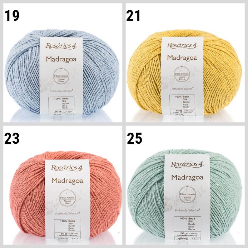 May include: Four skeins of yarn in different colors: light blue, yellow, peach, and light green. Each skein has a label that reads "Ros&aacute;rios 4 Madragoa" and includes information about the yarn, such as the fiber content and weight.