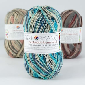 May include: A ball of Performance Sockwool Prime Multi yarn in a blue, green, and white colourway. The label reads "PERFORMANCE Sockwool Prime Multi 75% superwash wool 25% polyamide".