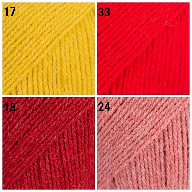 K&ouml;nnte beinhalten: Nahaufnahme von vier Garnproben in verschiedenen Farben. Oben links ist ein leuchtendes Gelb mit der Nummer 17. Oben rechts ist ein kr&auml;ftiges Rot mit der Nummer 33. Unten links ist ein tiefes Rot mit der Nummer 18. Unten rechts ist ein zartes Rosa mit der Nummer 24.