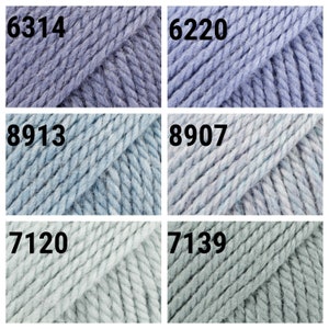 May include: Six skeins of yarn in various shades of blue and green. The yarn is a chunky weight and has a soft, fuzzy texture. The skeins are labeled with the numbers 6314, 6220, 8913, 8907, 7120, and 7139.