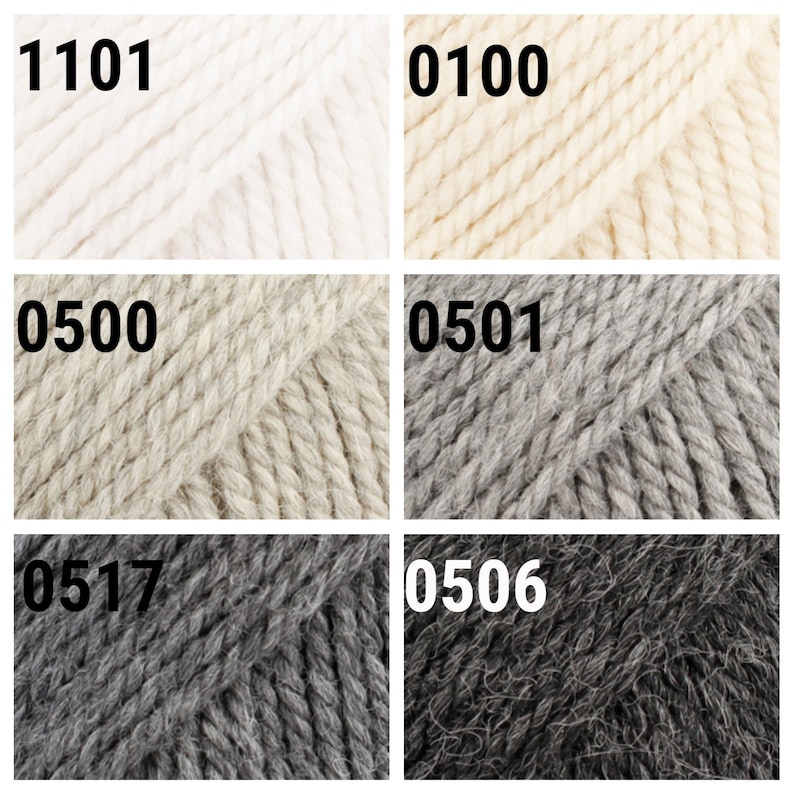 May include: Six skeins of yarn in different colors: white, cream, beige, light gray, dark gray, and charcoal gray. The yarn is labeled with numbers: 1101, 0100, 0500, 0501, 0517, and 0506.