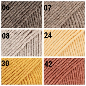 K&ouml;nnte beinhalten: Nahaufnahme von sechs Garnproben in verschiedenen Farben. Die Farben sind: 06 - Braun, 07 - Hellbraun, 08 - Beige, 24 - Hellgelb, 30 - Gelb und 42 - Orangebraun.