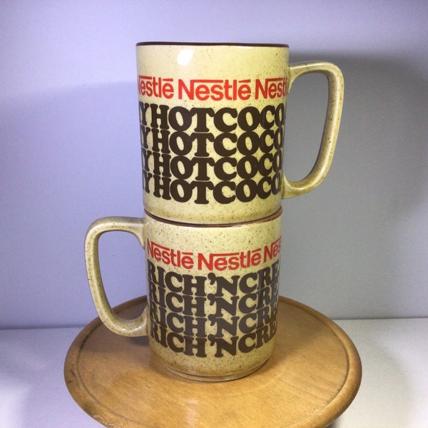 Pair of 2 vintage Nestle rich and creamy hot cocoa mugs. Made in Japan. Excellent, like new condition.