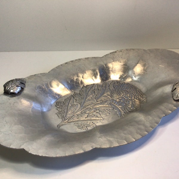 Continental floral hand wrought silverlook aluminum tray bowl with embossed chrysanthemum design.  Perfect for an entryway. Made in USA.