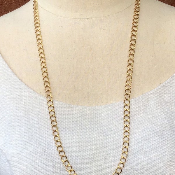Beautiful Crown Trifari 32 inch gold chain necklace.  Excellent condition.  Glistens in the light.  High quality.