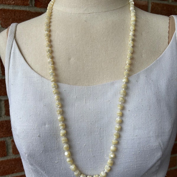Versatile 1960s 32” mother of pearl necklace with faux cultured pearl accents. A touch of vintage flair.