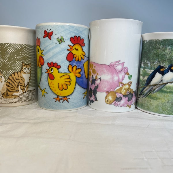 Selection of Dunoon Fine bone china and stoneware mugs with pair of birds, or pig, cat or chicken family.  Made in England or Scotland.