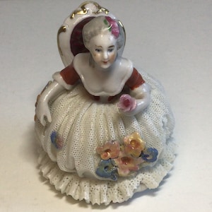 Lovely Dresden figurine.  Made in Germany.  Minor damage on lace skirt consistent with its age & the delicate nature of these figurines.