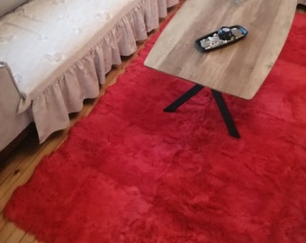 Red fur carpet of red sheepskin