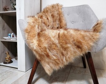 Beige raccoon fur throw or carpet